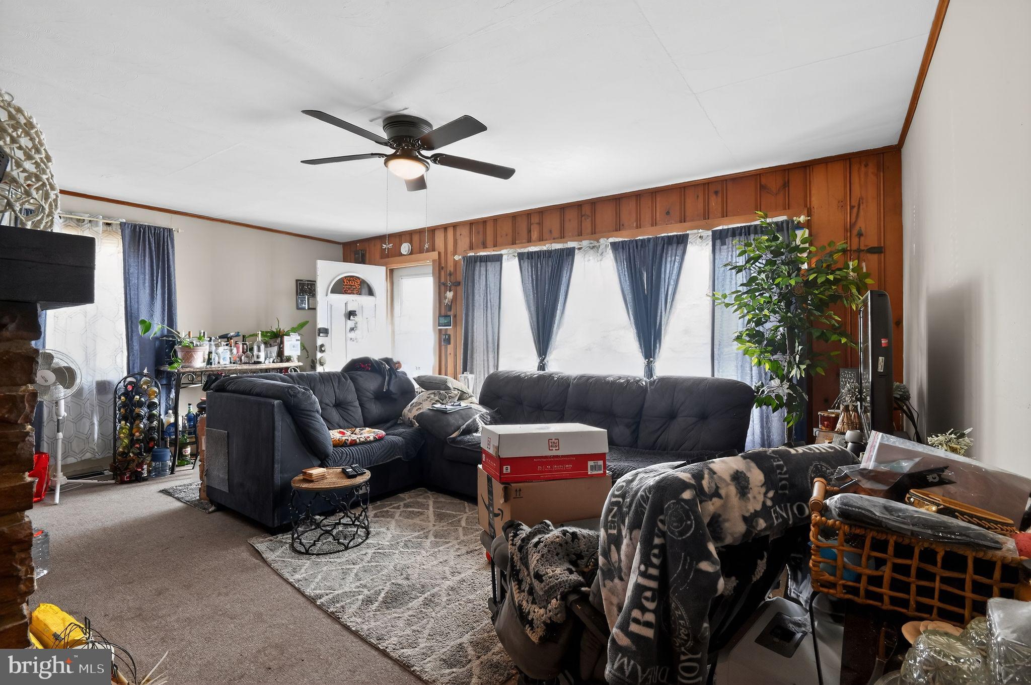 318 Newport Neck Road Newport, NJ 08345 - Photo 13 of 25 a living room with furniture and a flat screen tv