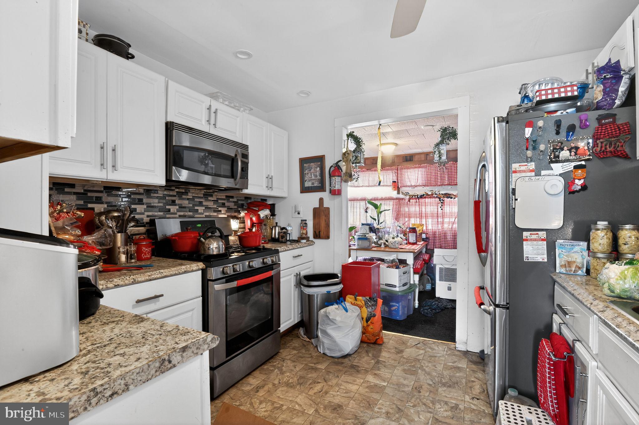 318 Newport Neck Road Newport, NJ 08345 - Photo 15 of 25 a kitchen with a refrigerator and a sink