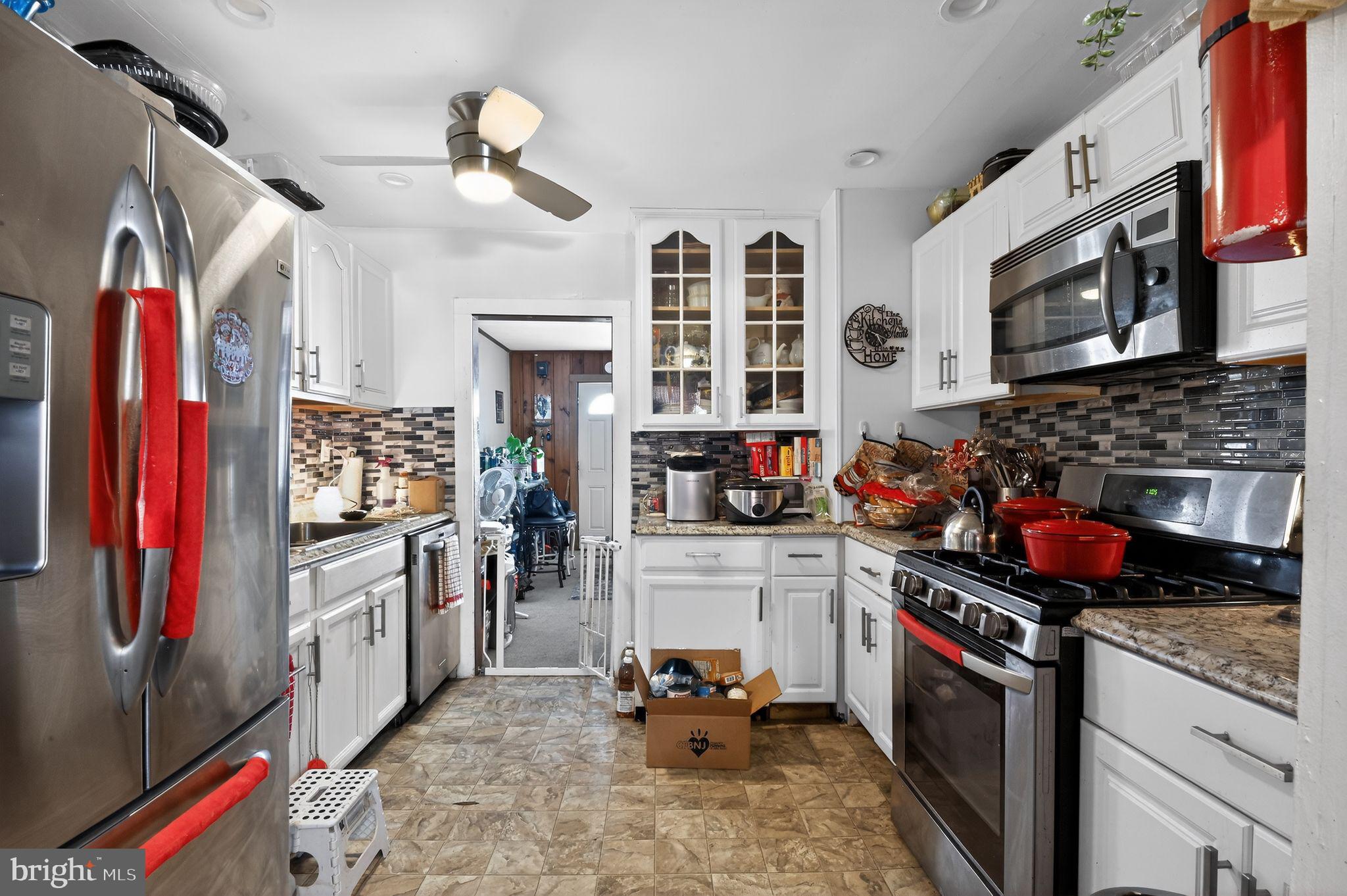 318 Newport Neck Road Newport, NJ 08345 - Photo 16 of 25 a kitchen with stainless steel appliances granite countertop a stove and a sink