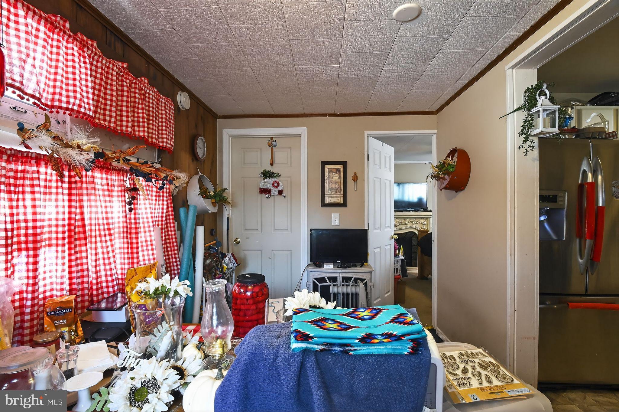 318 Newport Neck Road Newport, NJ 08345 - Photo 18 of 25 a bedroom with furniture and a book shelf
