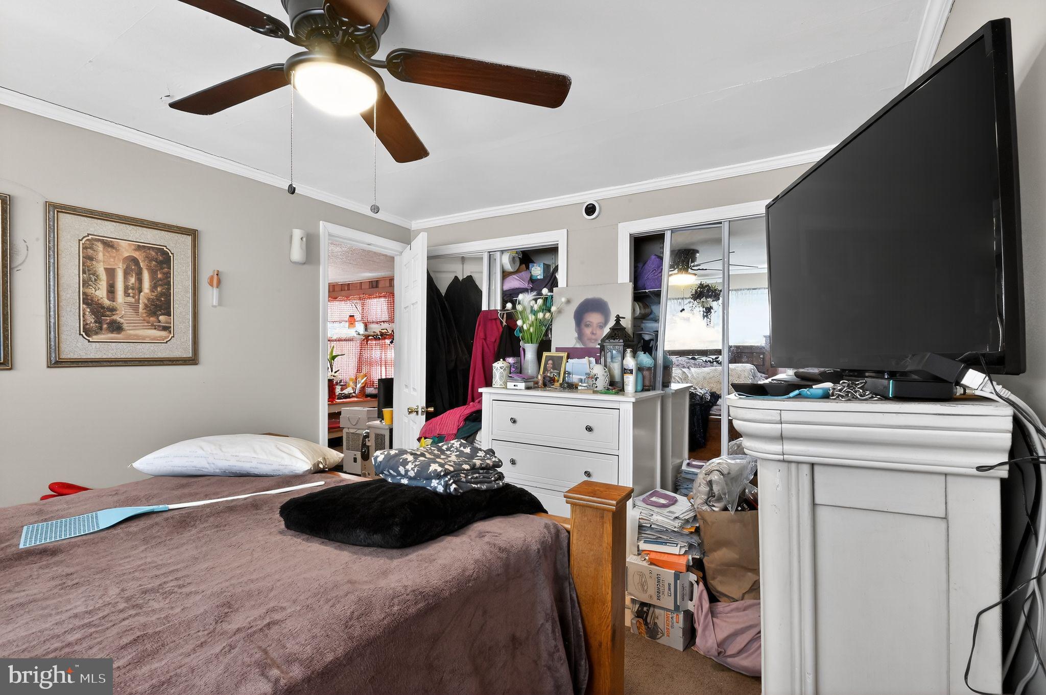 318 Newport Neck Road Newport, NJ 08345 - Photo 23 of 25 a bedroom with a bed and a flat screen tv