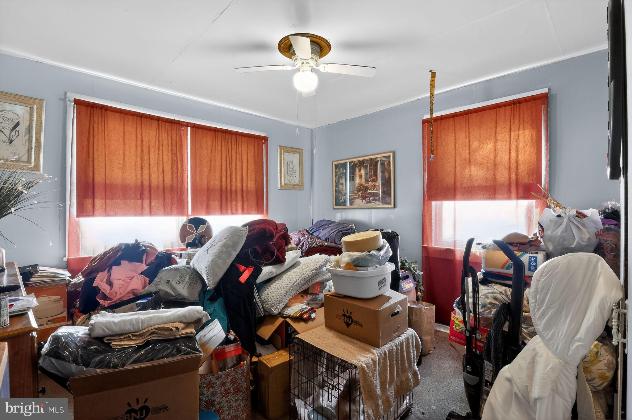 318 Newport Neck Road Newport, NJ 08345 - Photo 24 of 25 a living room filled with furniture and a chandelier
