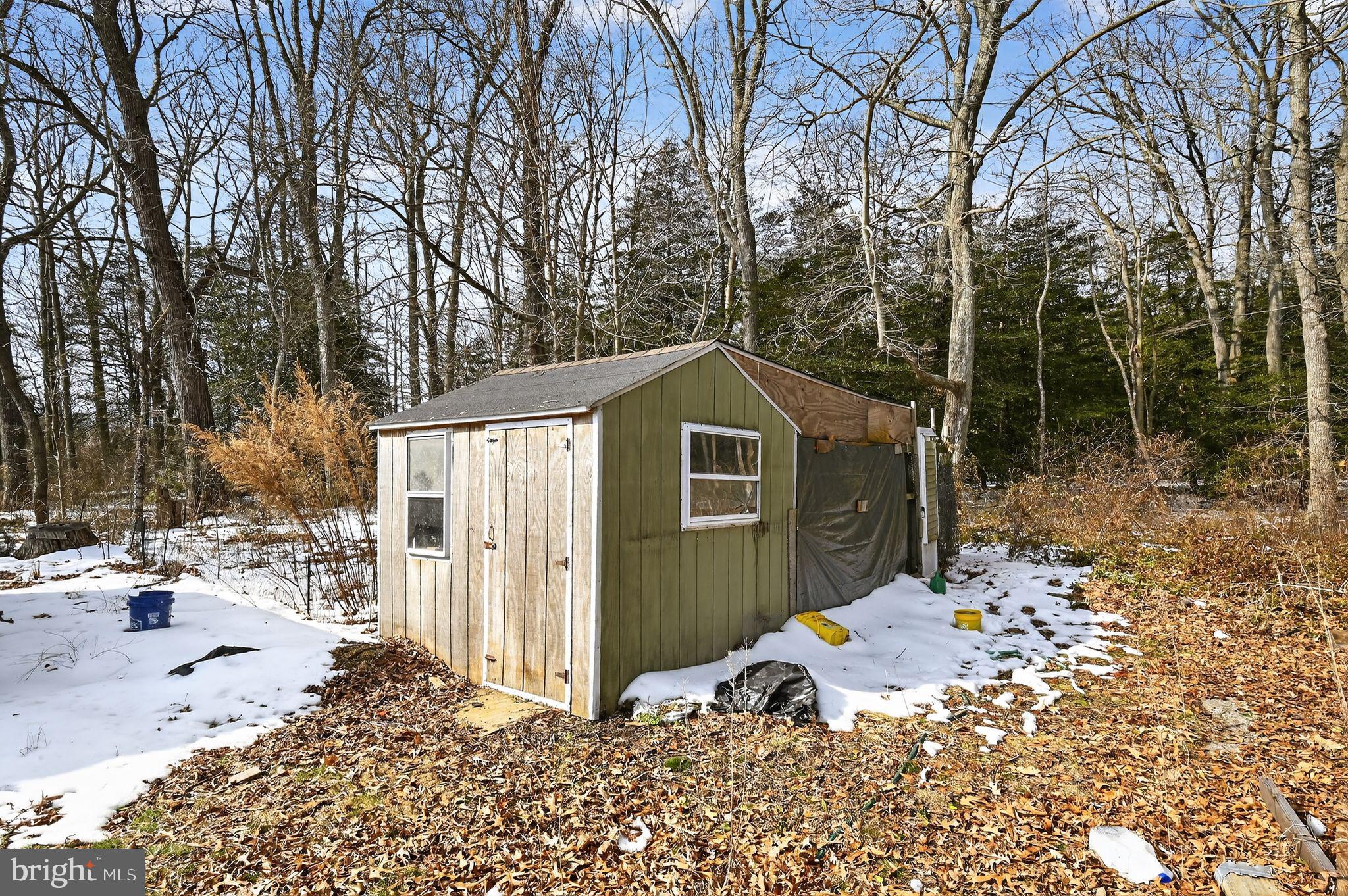 318 Newport Neck Road Newport, NJ 08345 - Photo 7 of 25 a view of a house with a yard covered in snow