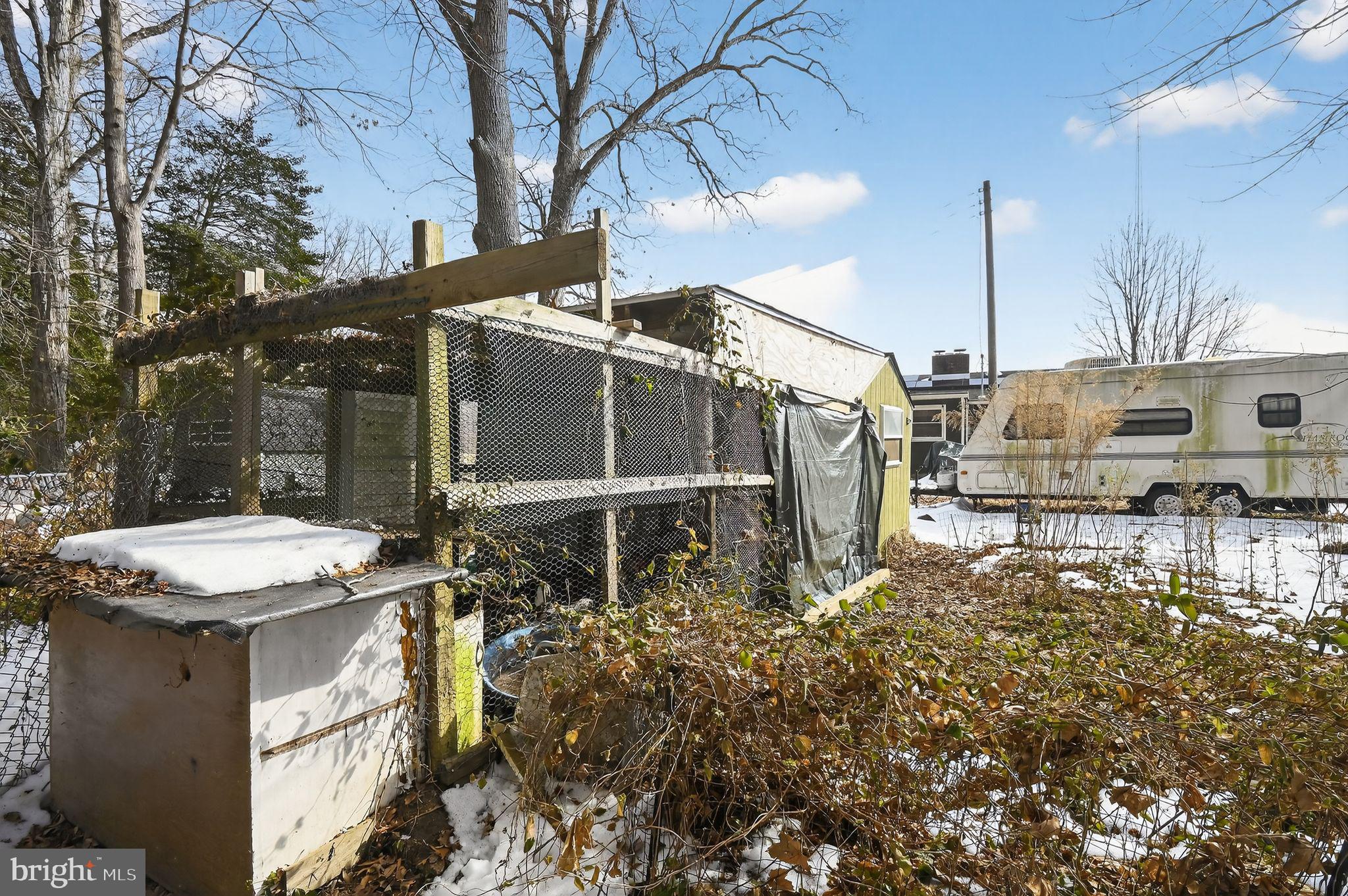318 Newport Neck Road Newport, NJ 08345 - Photo 8 of 25 a view of roof house with large trees and wooden fence
