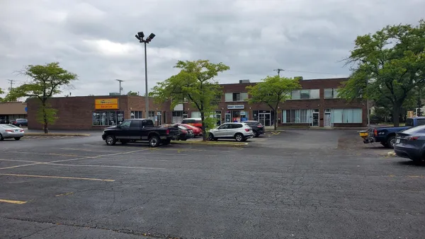 a view of street with parked cars
