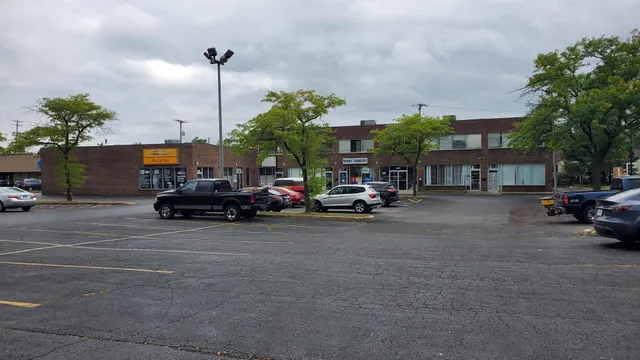 a view of street with parked cars