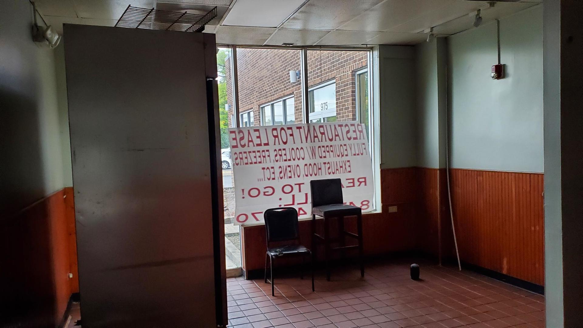 979 West Wise Road Schaumburg, IL 60193 - Photo 6 of 15 a view of a workspace with furniture and a window