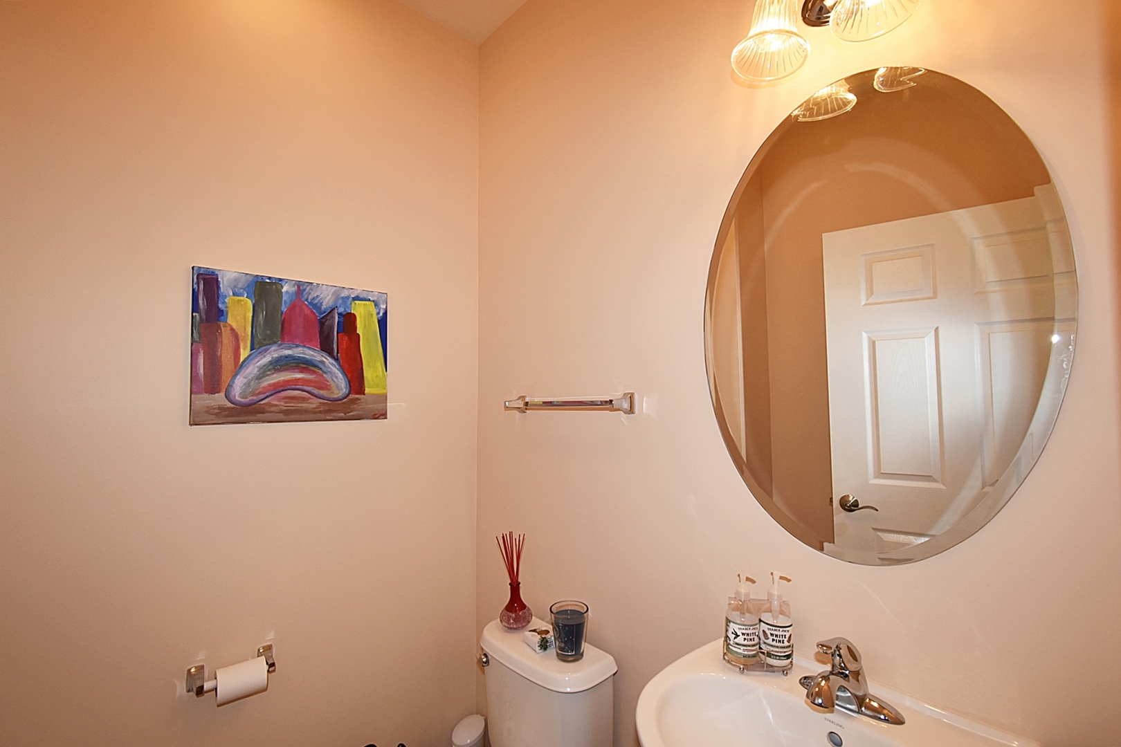 160 Orchards Pass Bartlett, IL 60103 - Photo 20 of 46 a bathroom with a sink mirror and toilet