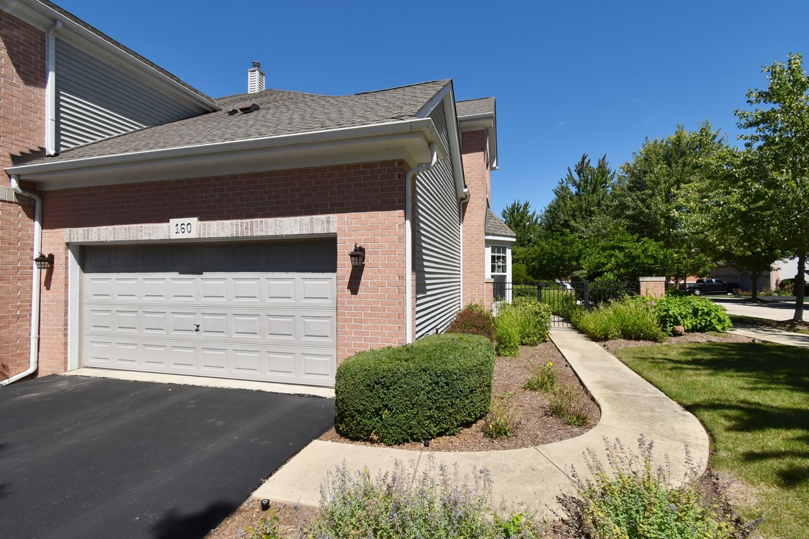 160 Orchards Pass Bartlett, IL 60103 - Photo 2 of 46 a view of backyard with plants and outdoor seating