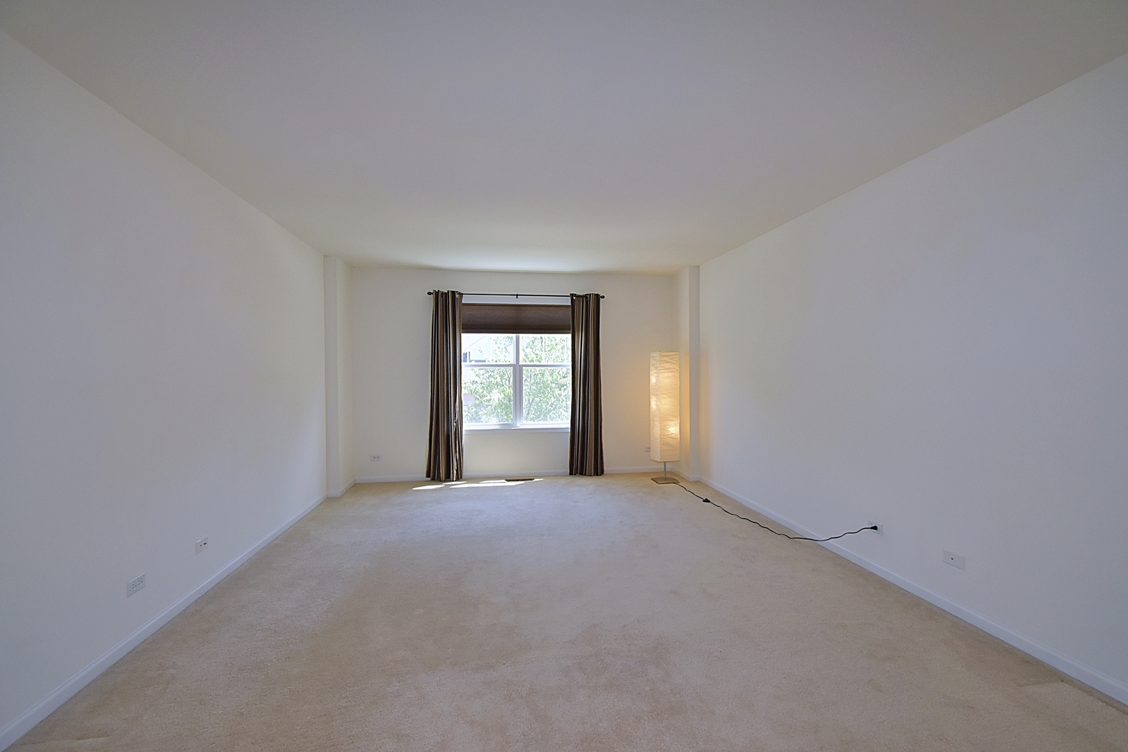 160 Orchards Pass Bartlett, IL 60103 - Photo 21 of 46 a view of an empty room with window and fire place