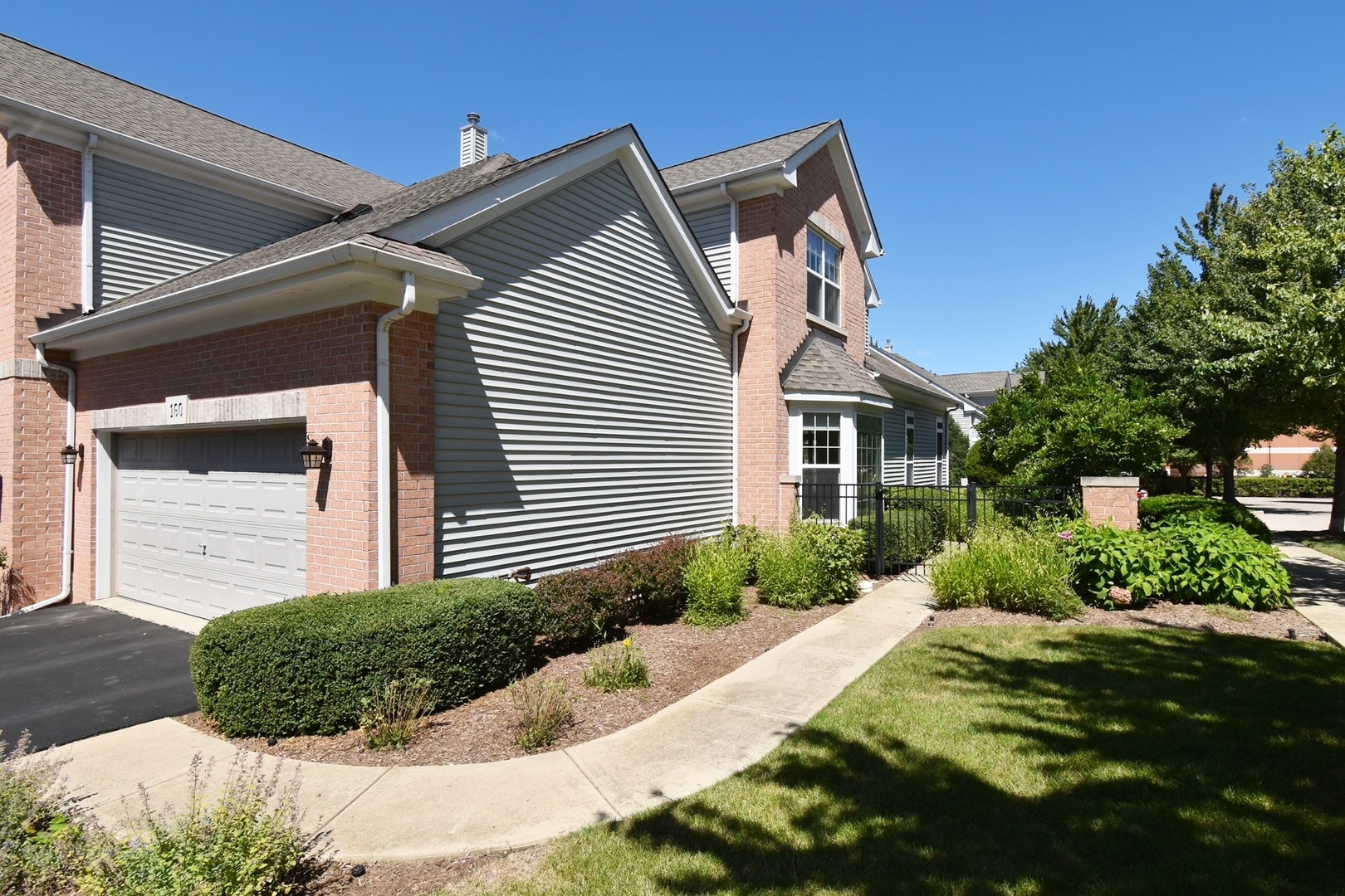 160 Orchards Pass Bartlett, IL 60103 - Photo 3 of 46 a front view of a house with a yard