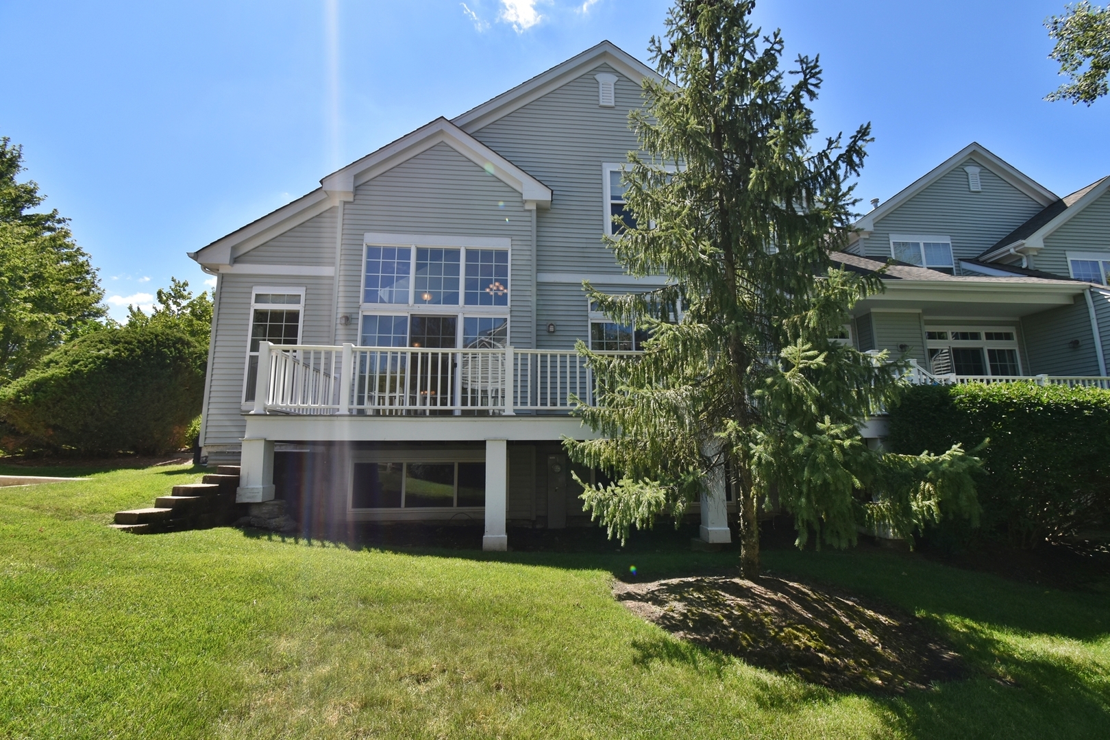 160 Orchards Pass Bartlett, IL 60103 - Photo 46 of 46 a front view of a house with a garden