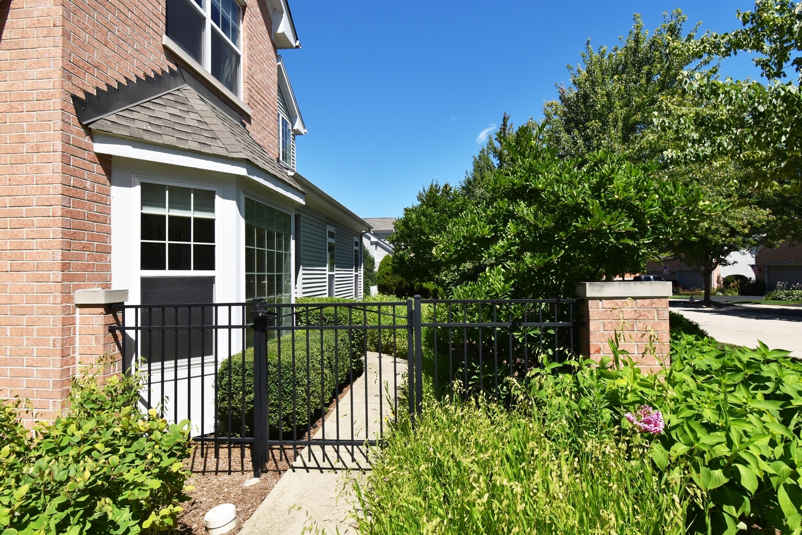 160 Orchards Pass Bartlett, IL 60103 - Photo 6 of 46 front view of a house with a garden