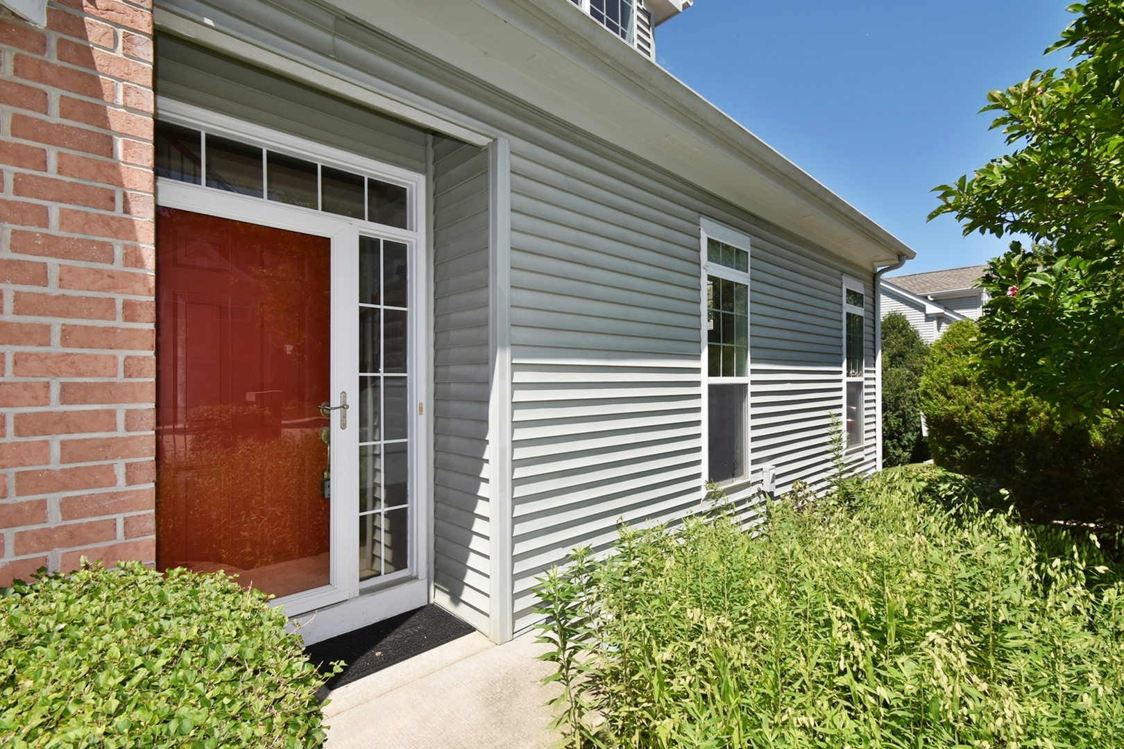 160 Orchards Pass Bartlett, IL 60103 - Photo 7 of 46 a view of a house with a large window and flower plants