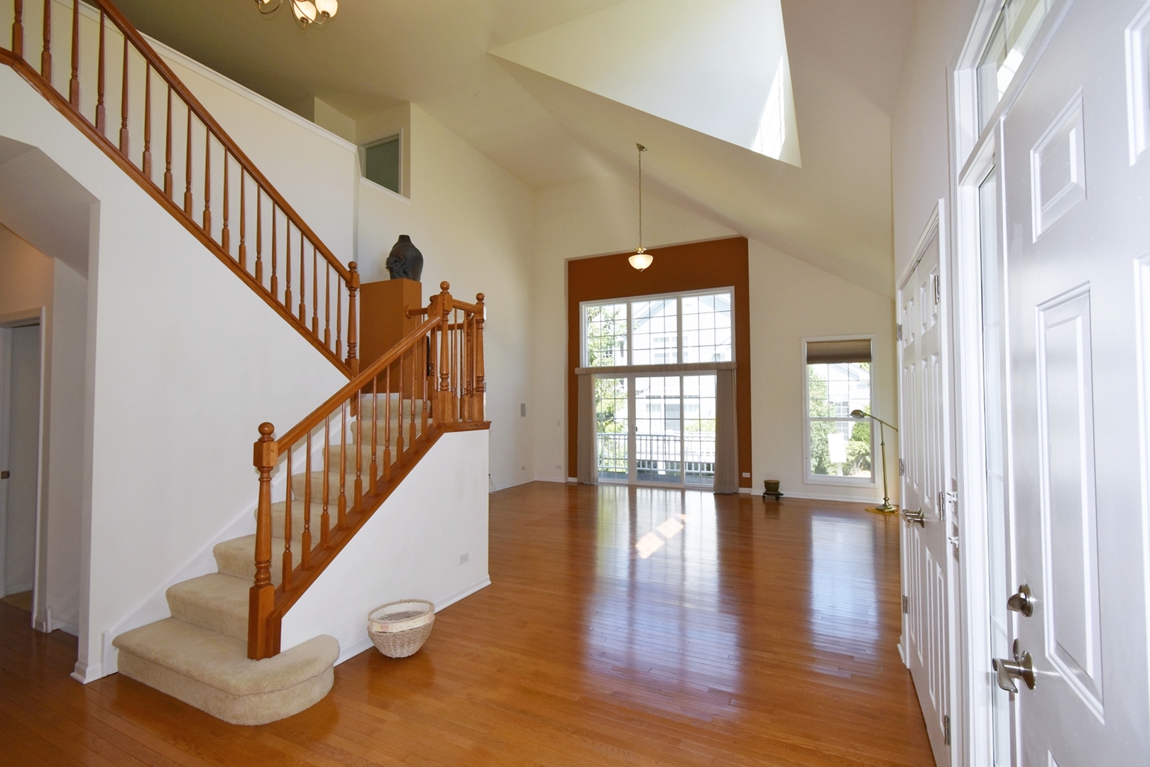 160 Orchards Pass Bartlett, IL 60103 - Photo 8 of 46 a view of an entryway with wooden floor and door
