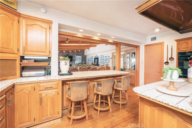 a spacious bedroom with a bed and a chandelier