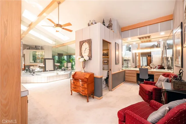 a view of a livingroom with furniture and a ceiling fan