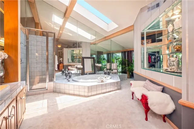 a utility room with cabinets washer and dryer