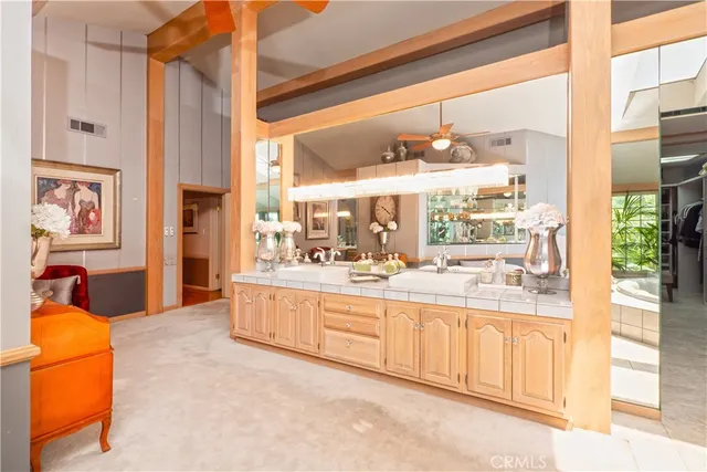 a bedroom with a bed and a large window with the outer view