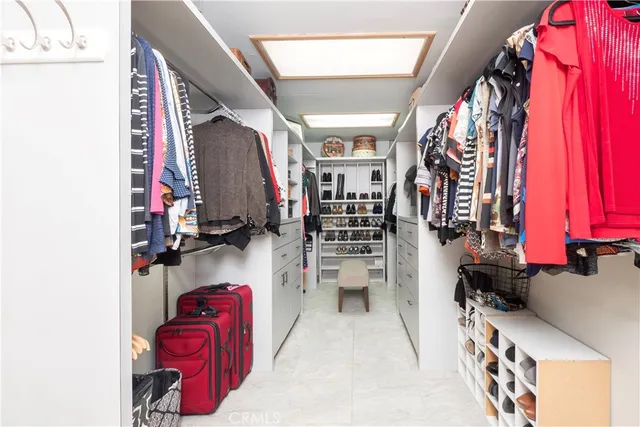 a view of a chair and tables in the patio in front of a house