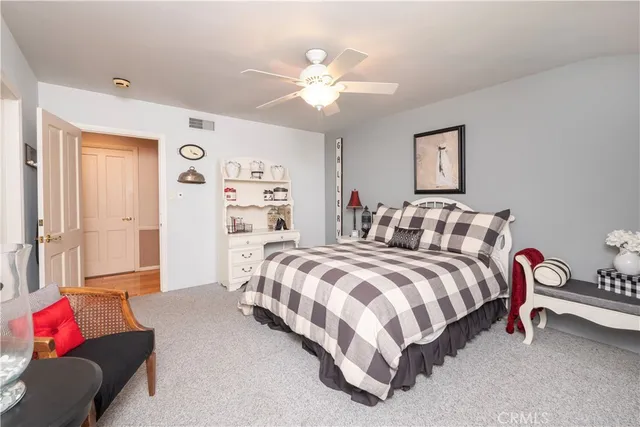 swimming pool view with a seating space and a garden view
