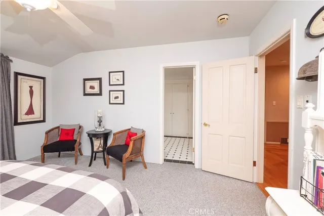 a view of a patio with a table and chairs under an umbrella