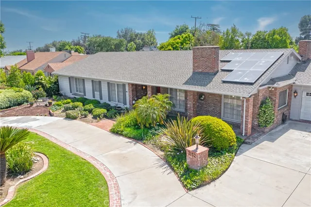 a view of a livingroom with furniture and a chandelier