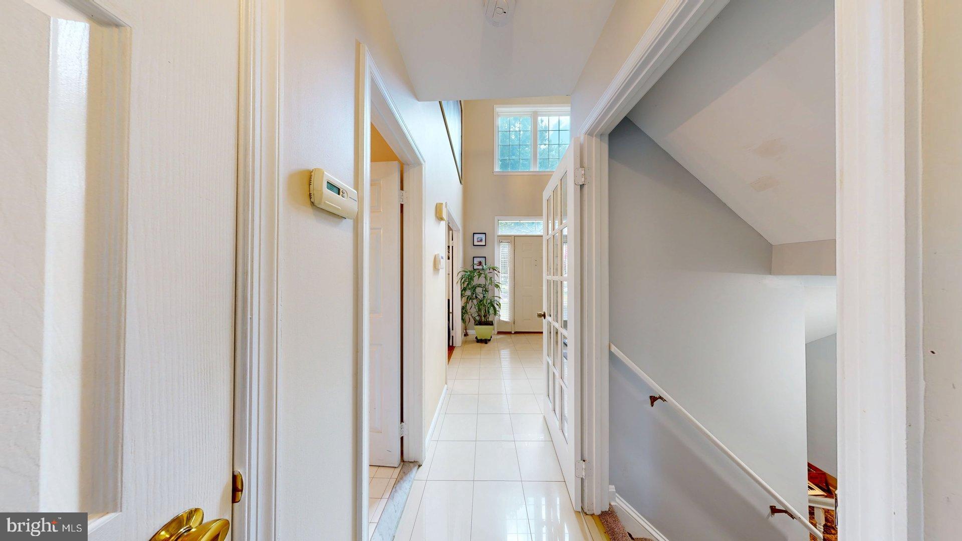 11901 Rustic Farm Court Germantown, MD 20874 - Photo 28 of 134 Inviting hallway with natural light.