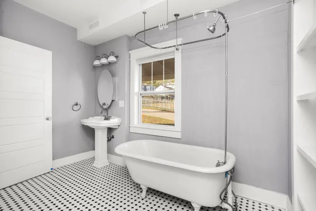 a bathroom with a sink toilet a shower and bathtub