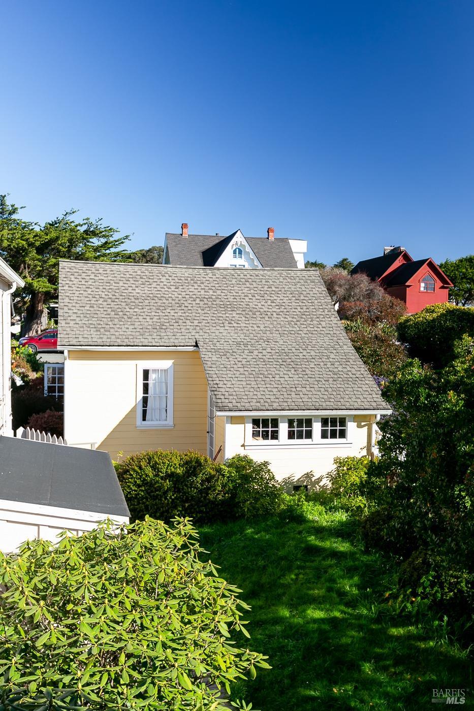 45040 Main Street Mendocino, CA 95460 - Photo 13 of 28 a view of a house with a yard and potted plants