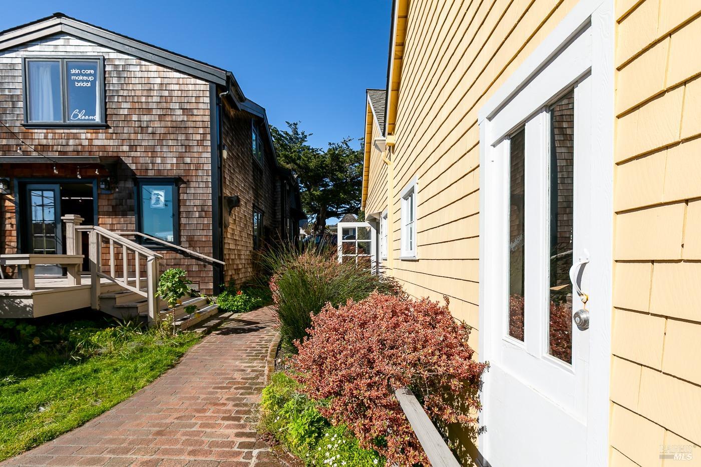 45040 Main Street Mendocino, CA 95460 - Photo 17 of 28 a front view of a house with a yard