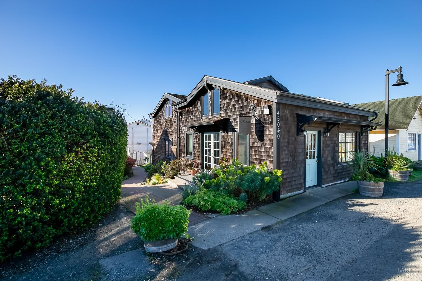 45040 Main Street Mendocino, CA 95460 - Photo 23 of 28 a front view of a house with garden