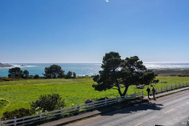 a view of a street with a yard