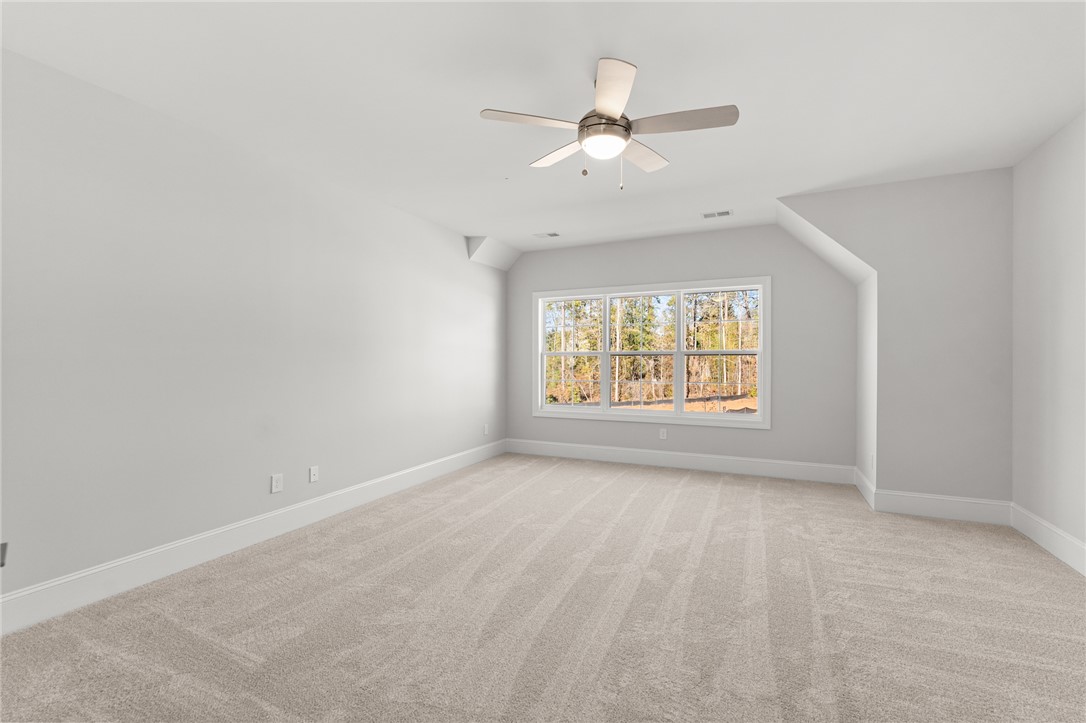 141 Rickys Path Easley, SC 29642 - Photo 31 of 40 This spacious room offers comfort and ample natural light, perfect for any lifestyle.