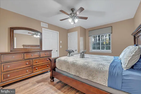 a bed sitting in a room next to a window