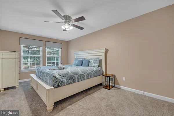 a bathroom with a granite countertop sink a bathtub and shower