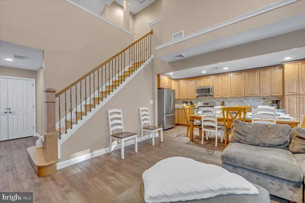 a spacious bedroom with a bed and a large window