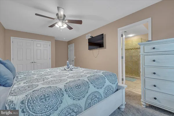 a bathroom with a bath tub and shower
