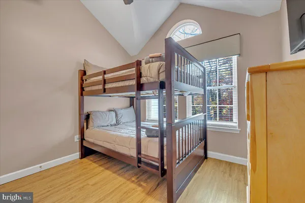 a bedroom with a bed and a night stand