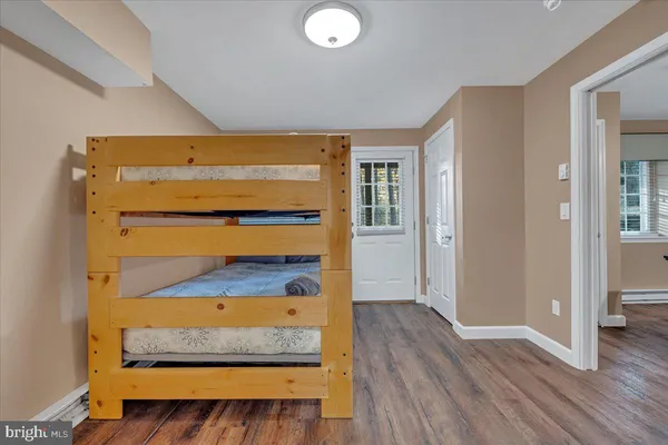 hallway view with wooden floor