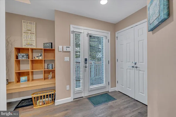 a view of front door with wooden floor