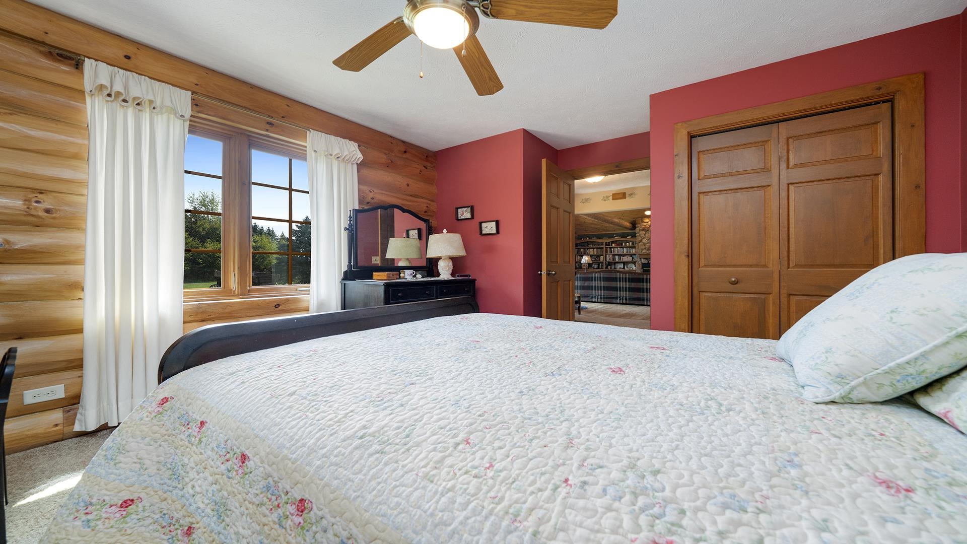 5810 West Lightsville Road Leaf River, IL 61047 - Photo 12 of 68 a bedroom with a large bed and a large dresser