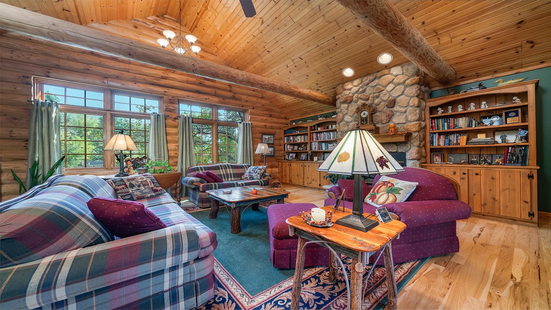 5810 West Lightsville Road Leaf River, IL 61047 - Photo 13 of 68 a living room with furniture a rug and a chandelier