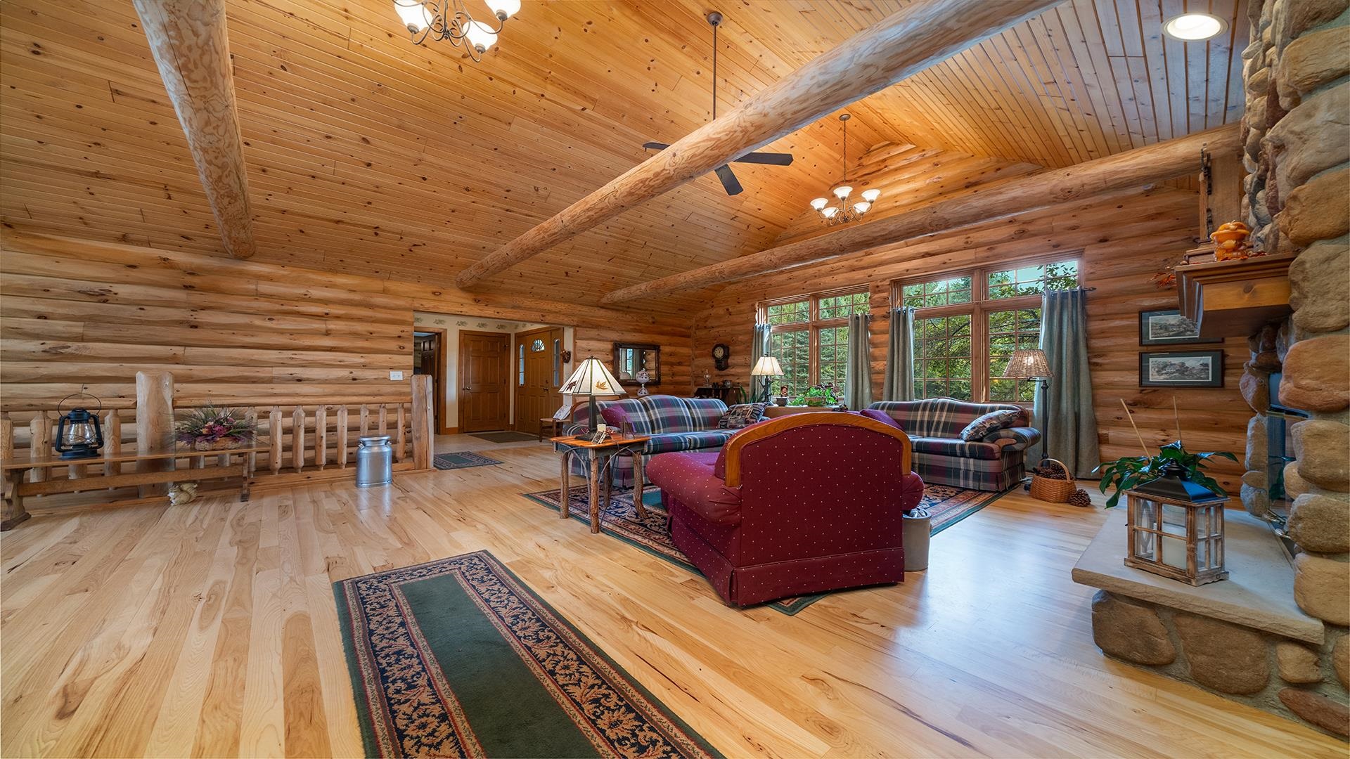 5810 West Lightsville Road Leaf River, IL 61047 - Photo 15 of 68 a living room with furniture a wooden floor and next to a window