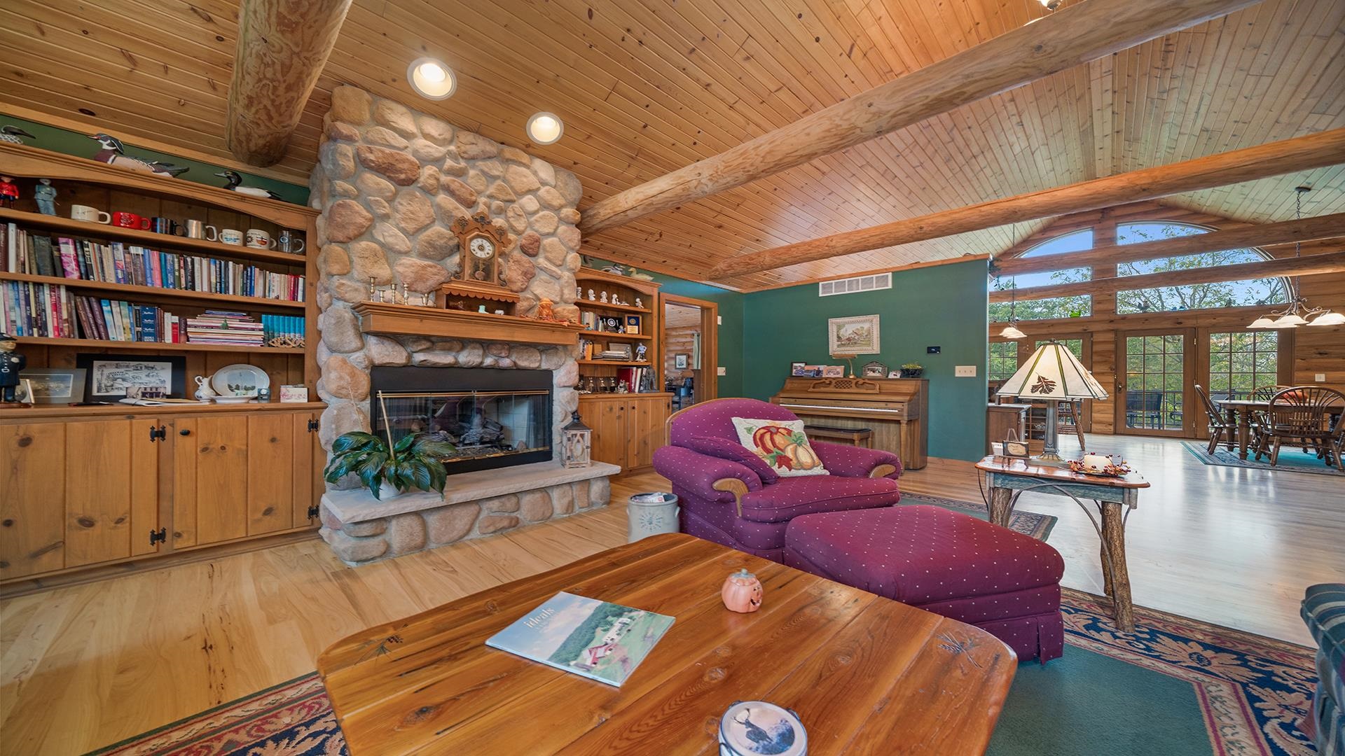 5810 West Lightsville Road Leaf River, IL 61047 - Photo 2 of 68 a living room with furniture a fireplace and a flat screen tv