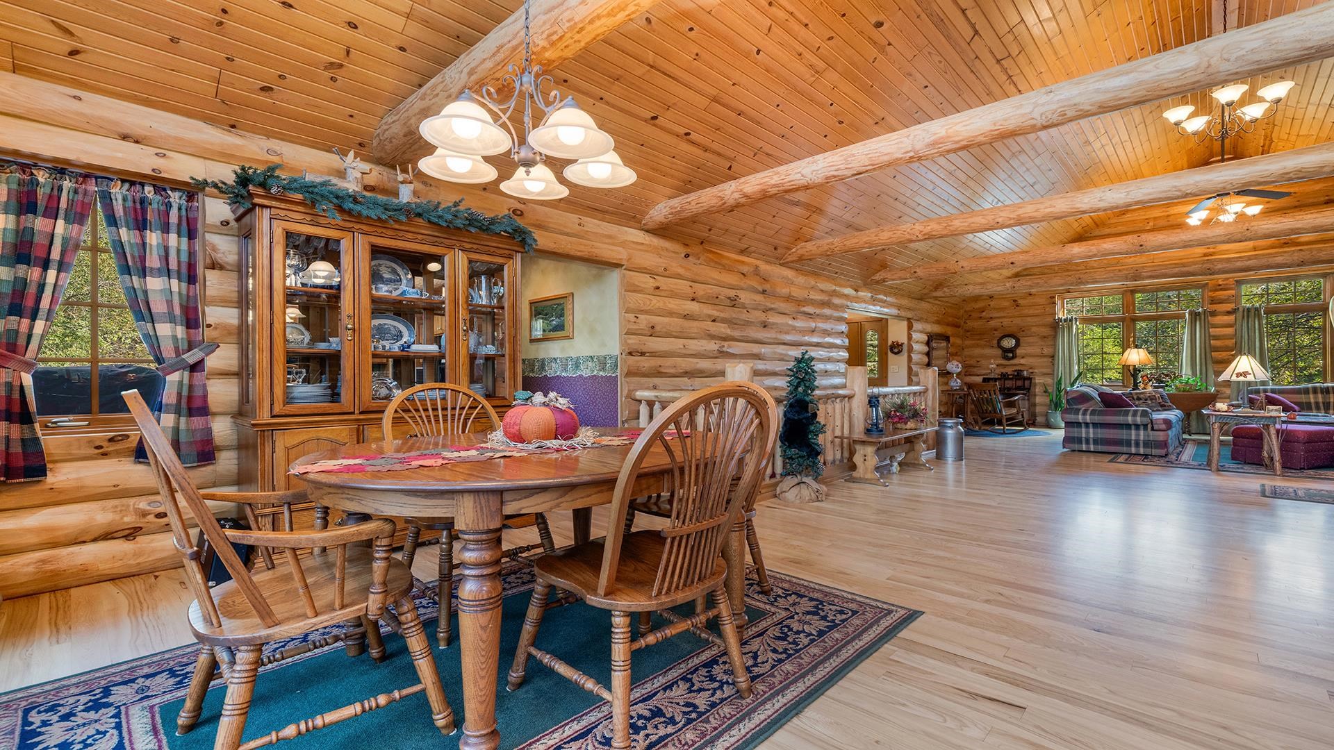 5810 West Lightsville Road Leaf River, IL 61047 - Photo 21 of 68 a dining room with furniture and wooden floor