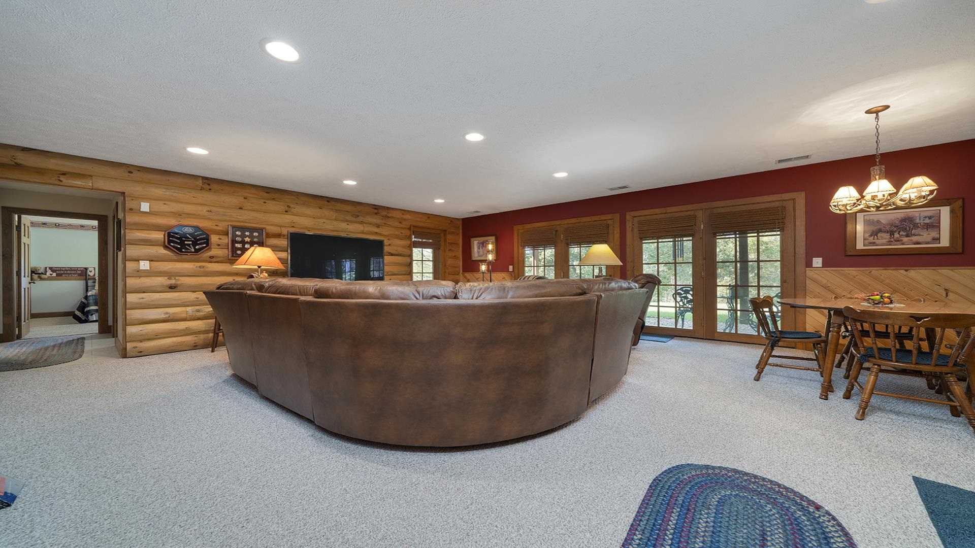 5810 West Lightsville Road Leaf River, IL 61047 - Photo 25 of 68 a living room with furniture a dining table and chairs with kitchen view
