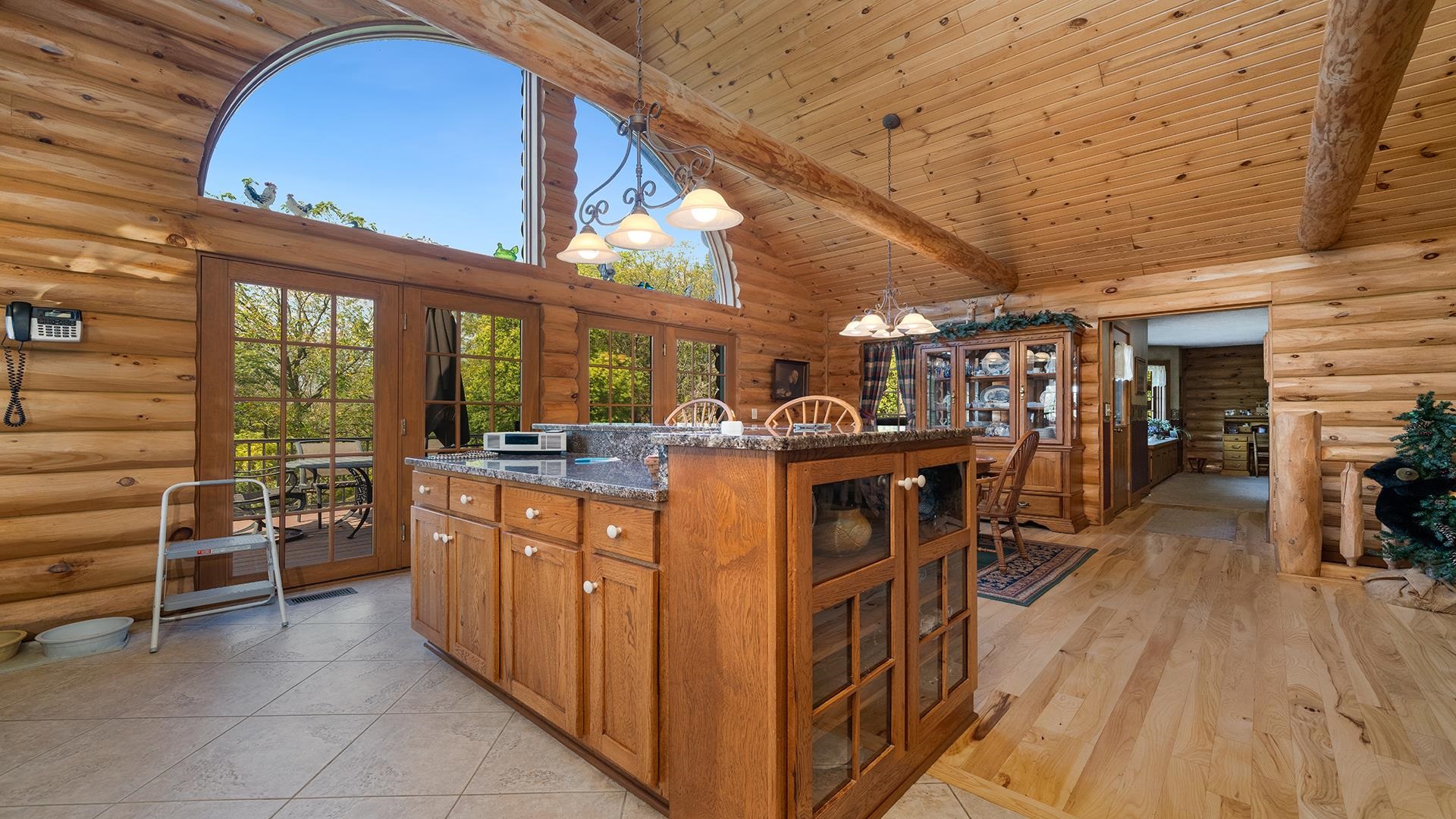 5810 West Lightsville Road Leaf River, IL 61047 - Photo 4 of 68 a view of a kitchen with furniture and wooden floor