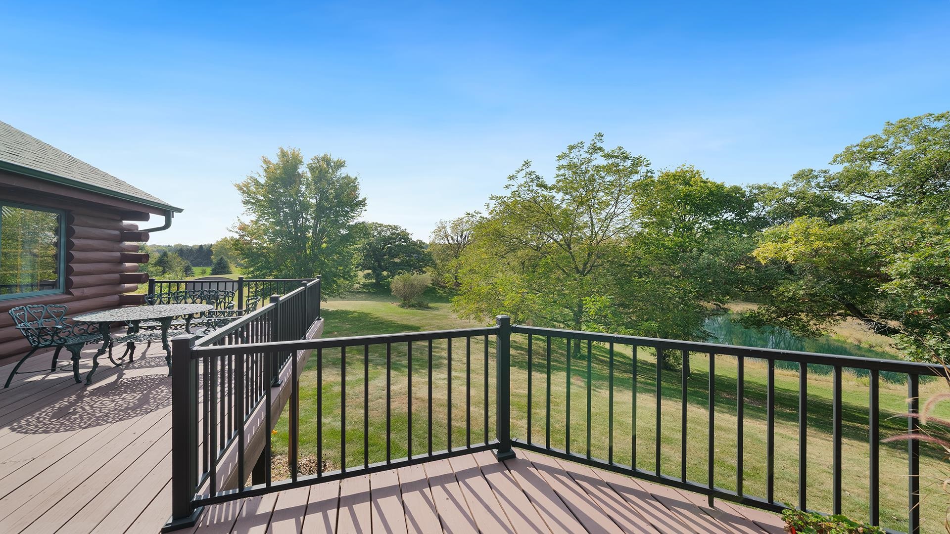 5810 West Lightsville Road Leaf River, IL 61047 - Photo 41 of 68 a view of a balcony with wooden floor