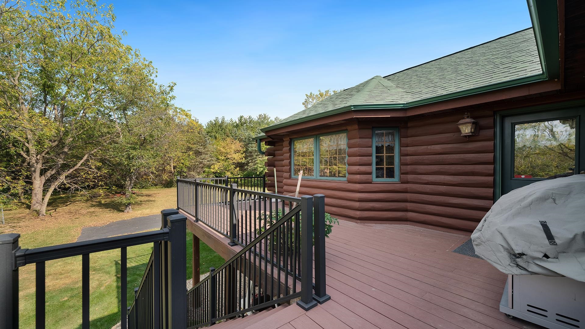 5810 West Lightsville Road Leaf River, IL 61047 - Photo 42 of 68 a view of a balcony with wooden floor and fence